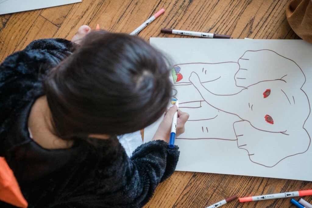 photo of a child writing on paper