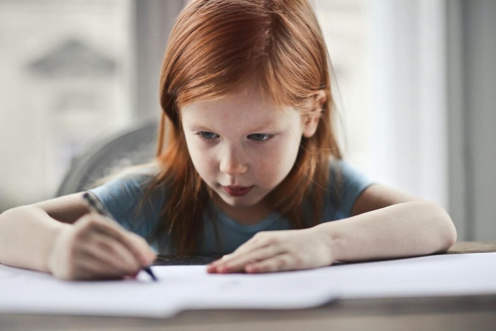 girl writing on paper